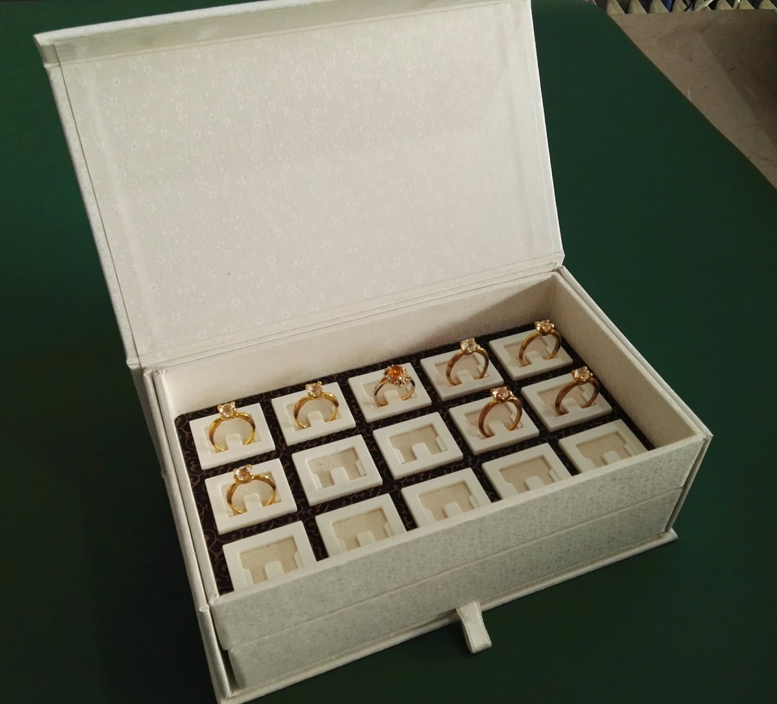 Open jewelry box with ring inserts